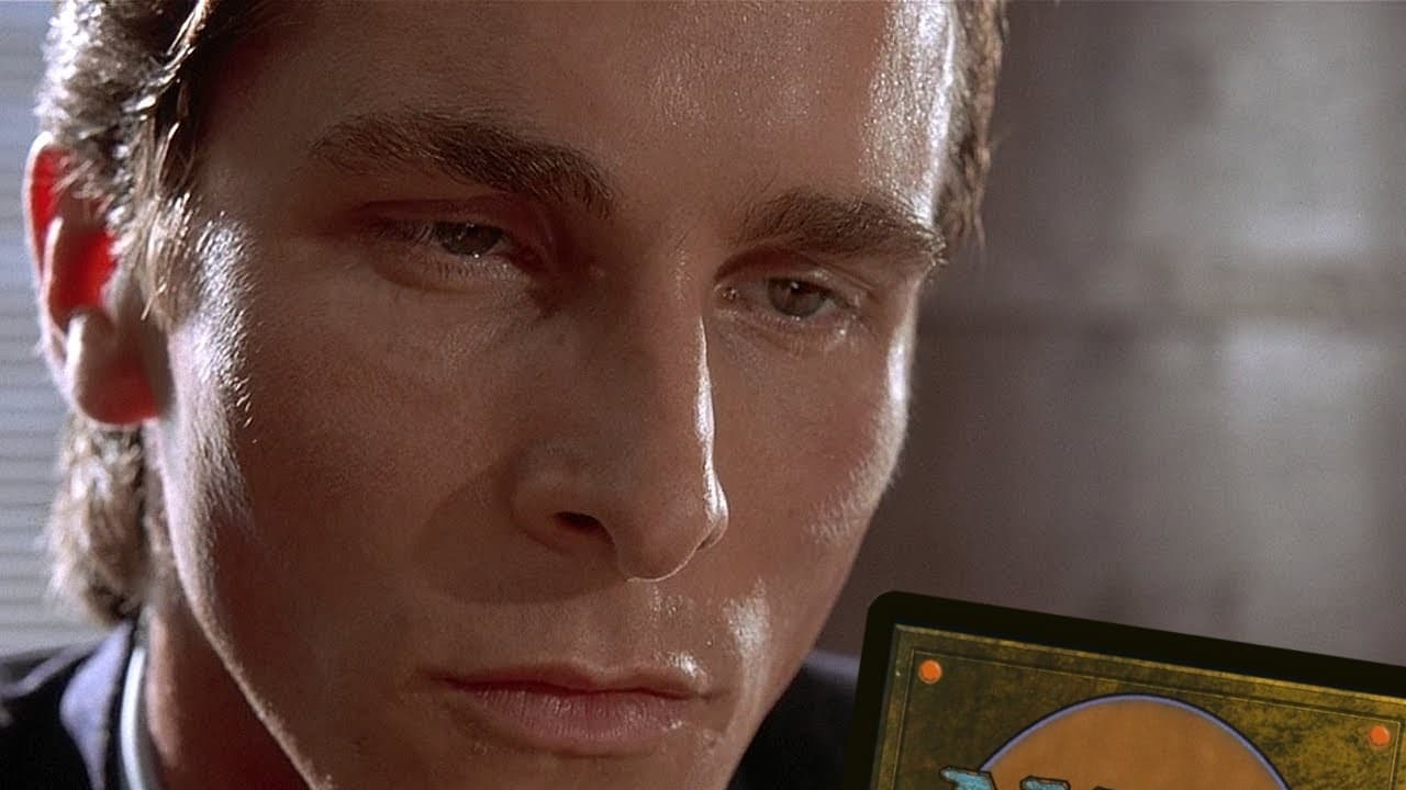 Patrick Bateman looking at business card